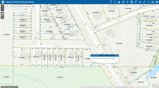 a white cabinet with black white and next to a white refrigerator
