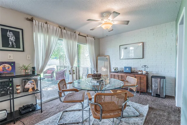 a view of a livingroom with furniture and a chandelier