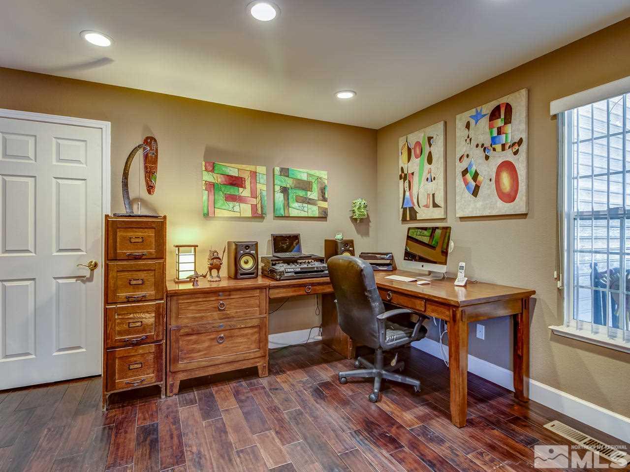 14410 Ghost Rider Drive Reno, NV 89511 - Photo 12 of 25 a view of a workspace with furniture and a window