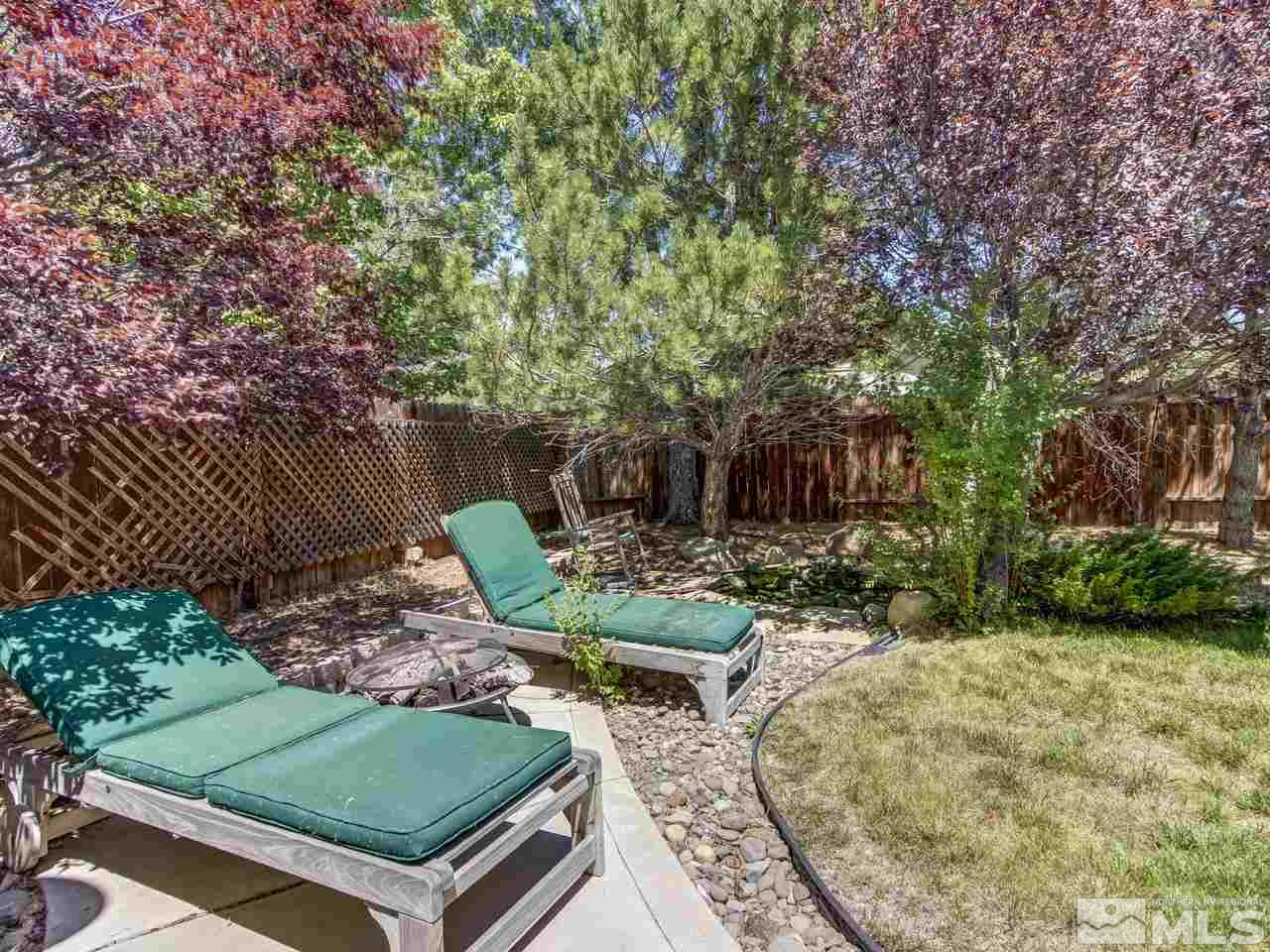 14410 Ghost Rider Drive Reno, NV 89511 - Photo 19 of 25 a view of a backyard with sitting area