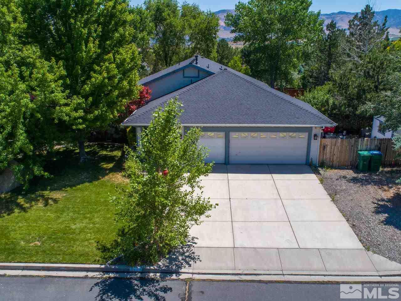 14410 Ghost Rider Drive Reno, NV 89511 - Photo 2 of 25 a house view with a garden