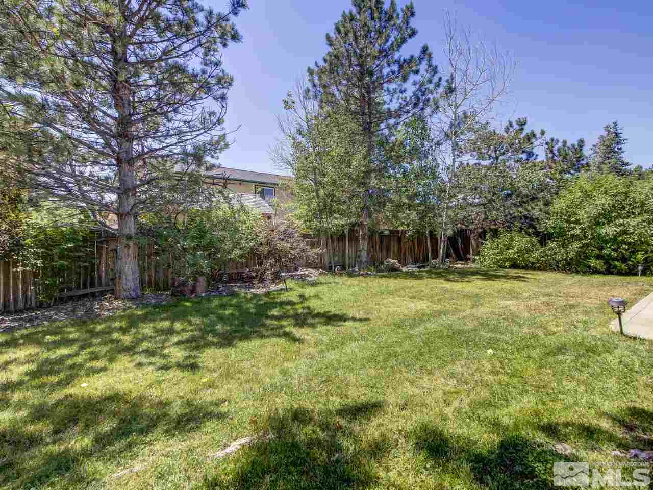 14410 Ghost Rider Drive Reno, NV 89511 - Photo 23 of 25 a view of a house with a yard