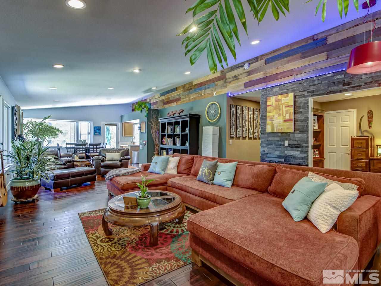 14410 Ghost Rider Drive Reno, NV 89511 - Photo 4 of 25 a living room with furniture and a potted plant