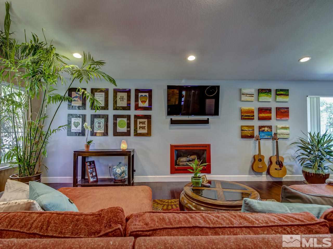 14410 Ghost Rider Drive Reno, NV 89511 - Photo 5 of 25 a living room with furniture and a potted plant