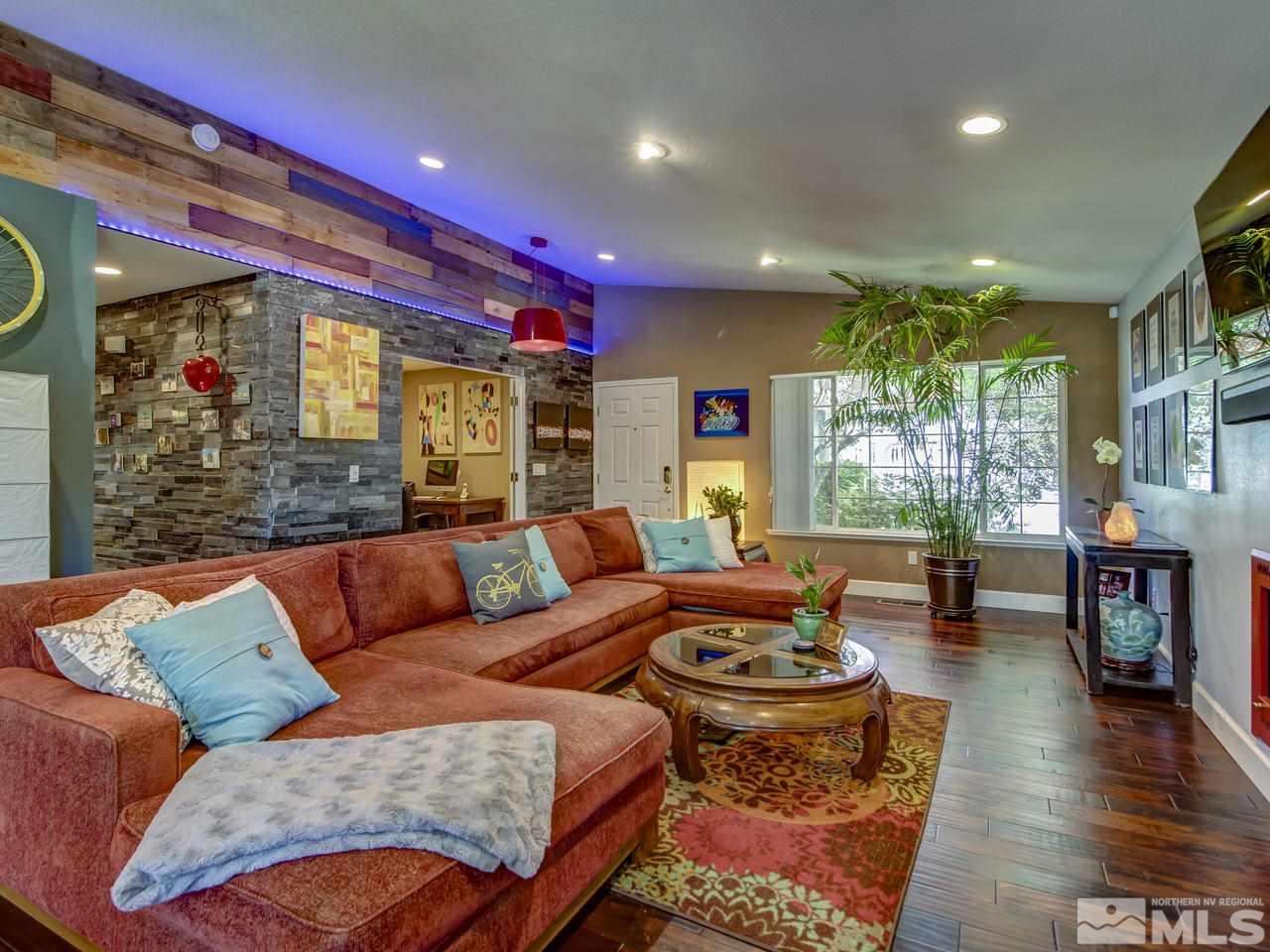 14410 Ghost Rider Drive Reno, NV 89511 - Photo 6 of 25 a living room with furniture and a fireplace