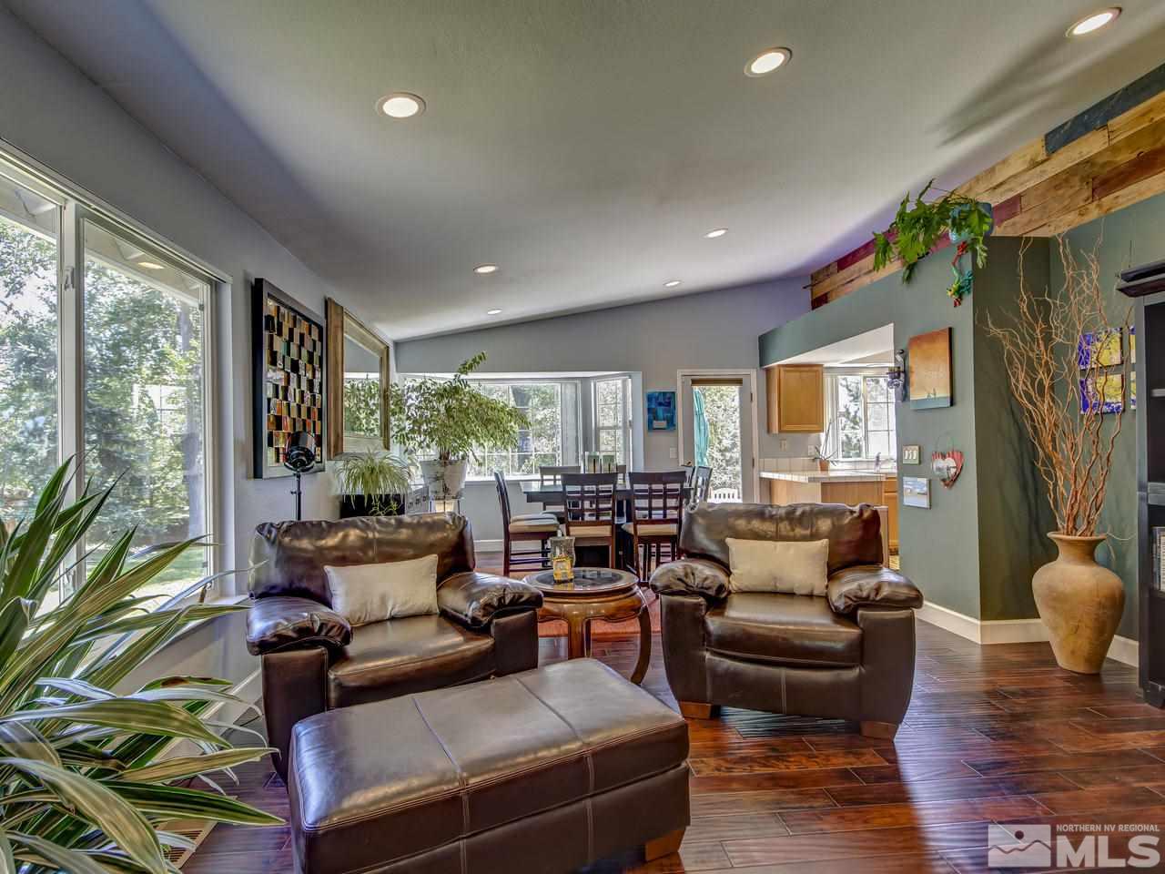 14410 Ghost Rider Drive Reno, NV 89511 - Photo 7 of 25 a living room with furniture and a large window