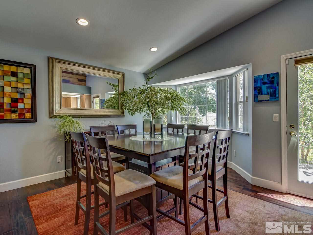 14410 Ghost Rider Drive Reno, NV 89511 - Photo 8 of 25 a view of a dining room with furniture window and outside view