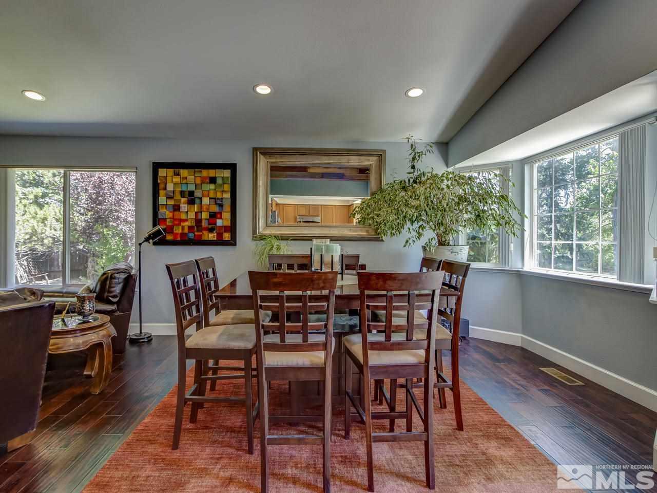 14410 Ghost Rider Drive Reno, NV 89511 - Photo 9 of 25 a view of a dining room with furniture window and outside view