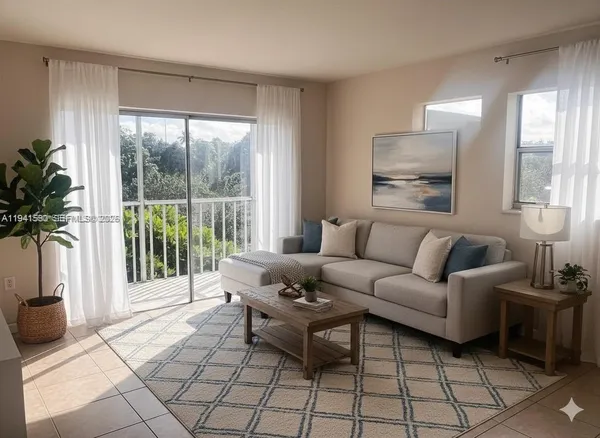 a living room with furniture and a large window