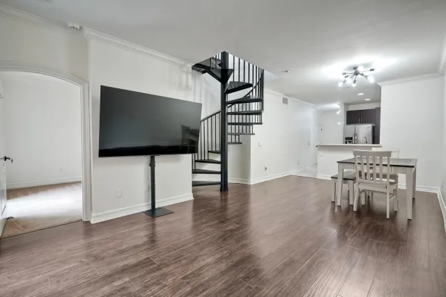 a view of a livingroom with furniture and wooden floor