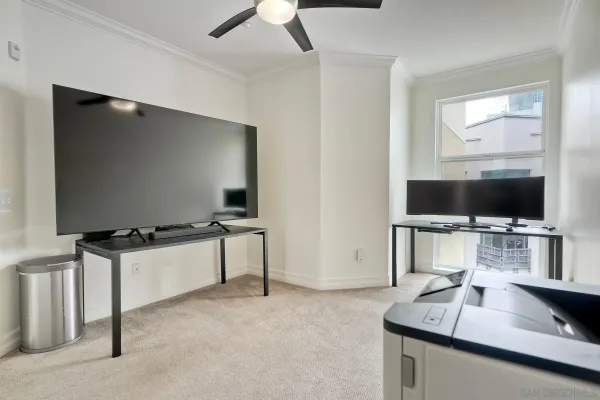 a room with furniture and flat screen tv