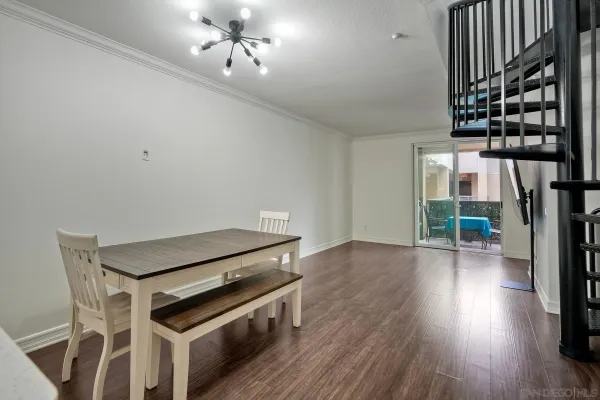 a kitchen with wooden floors and a sink