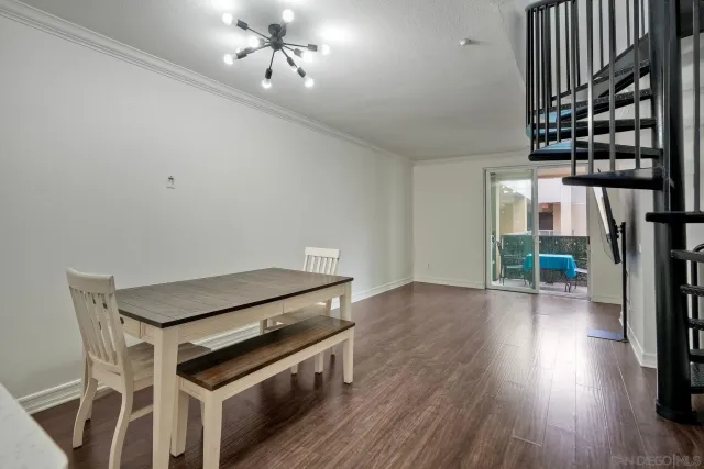 a kitchen with wooden floors and a sink