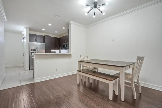 a view of kitchen with wooden floor and window