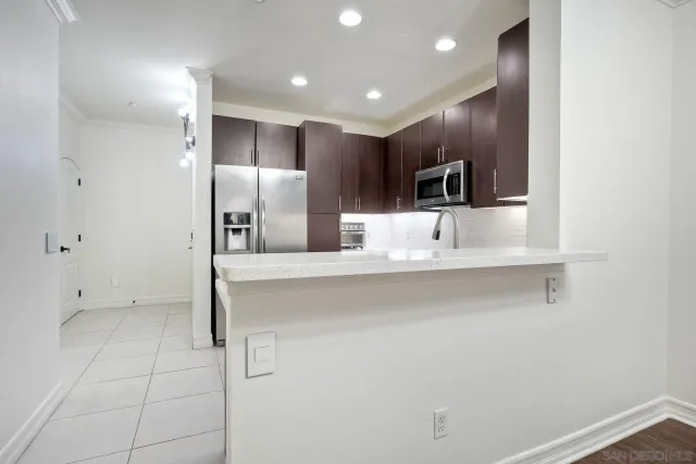 a bathroom with a sink a large mirror and a shower
