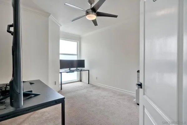 a view of workspace with a window and a ceiling fan