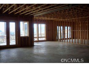 71 Woodhaven Ridge Clyde, NC 28721 - Photo 22 of 24 a view of an empty room with wooden floor and a window