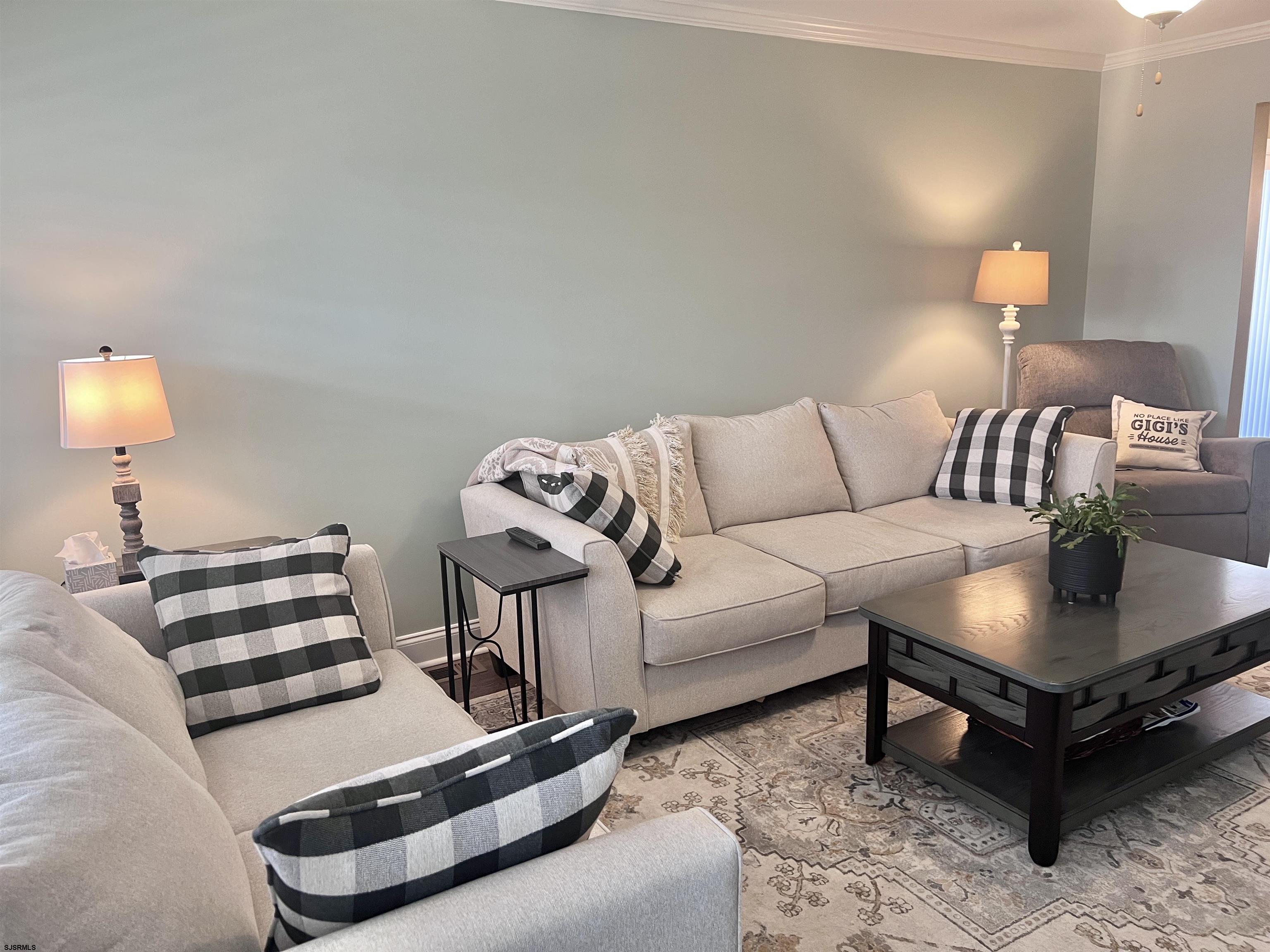 2058 Highway 9 Ocean View, NJ 08230 - Photo 15 of 37 a living room with furniture and a lamp