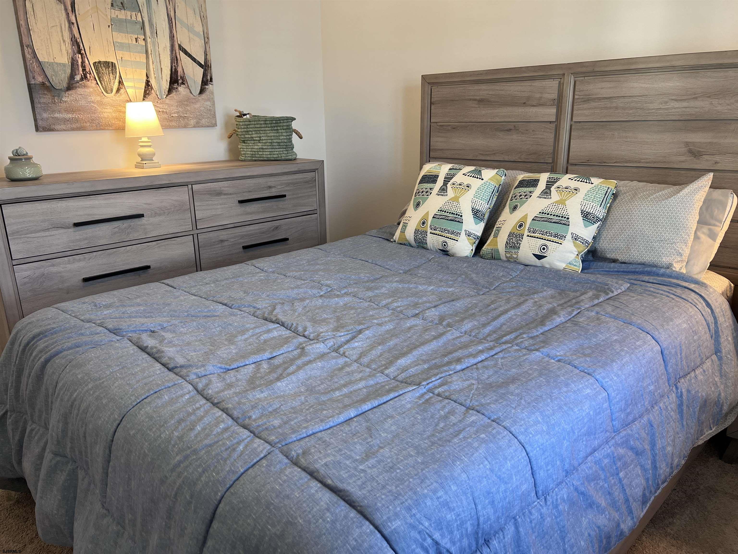 2058 Highway 9 Ocean View, NJ 08230 - Photo 23 of 37 a bed sitting in a bedroom next to a window