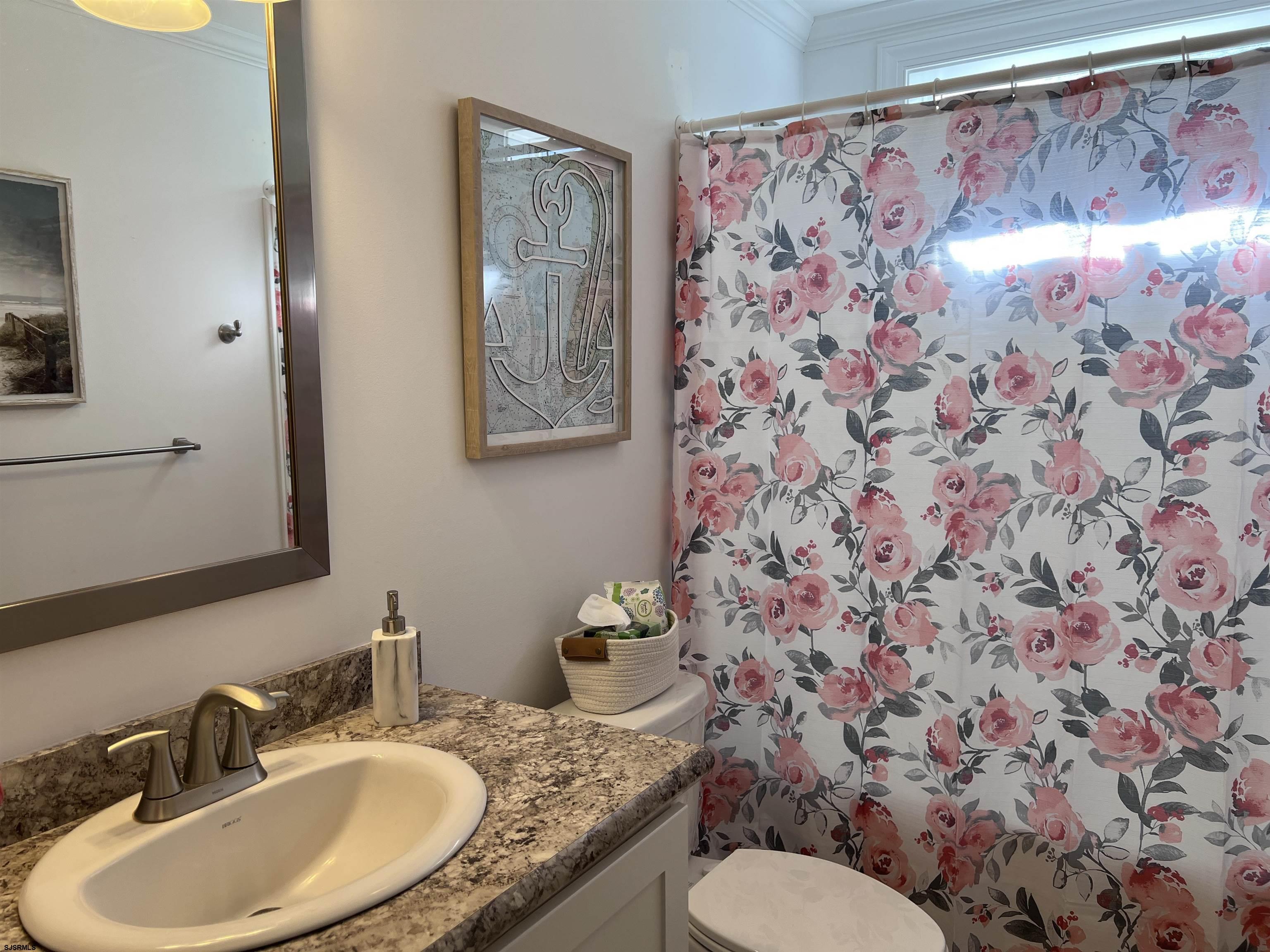 2058 Highway 9 Ocean View, NJ 08230 - Photo 26 of 37 a bathroom with a granite countertop sink and a mirror