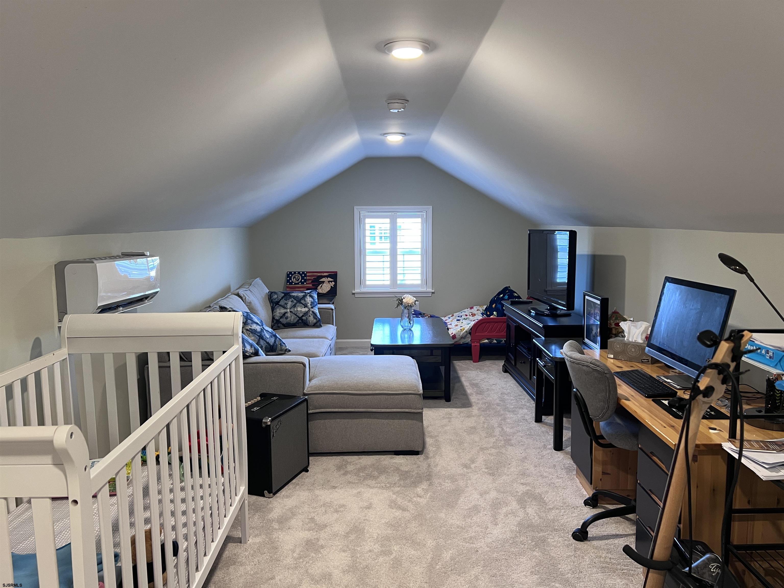 2058 Highway 9 Ocean View, NJ 08230 - Photo 31 of 37 a living room with furniture and a chandelier