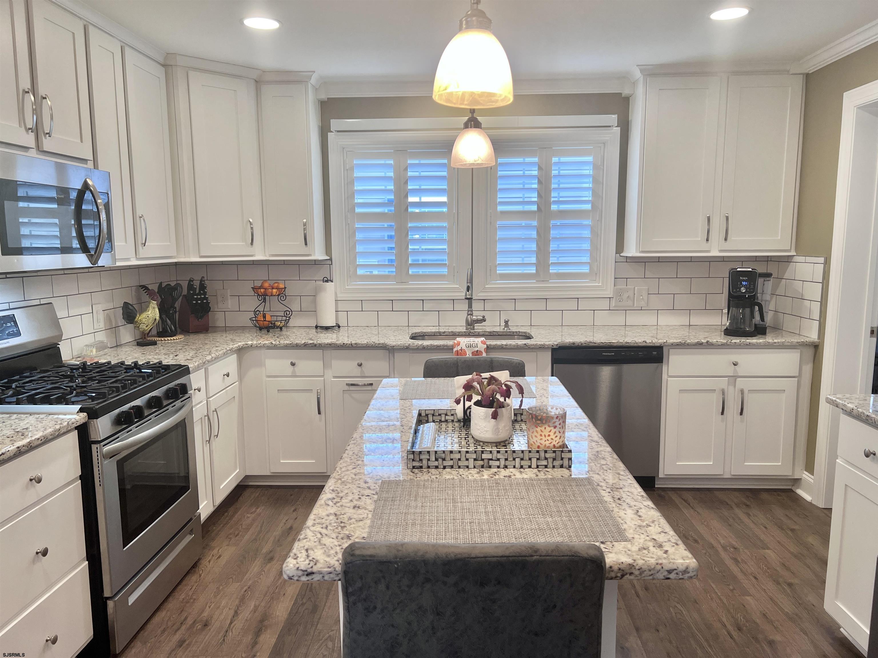 2058 Highway 9 Ocean View, NJ 08230 - Photo 6 of 37 a kitchen with a stove sink and cabinets