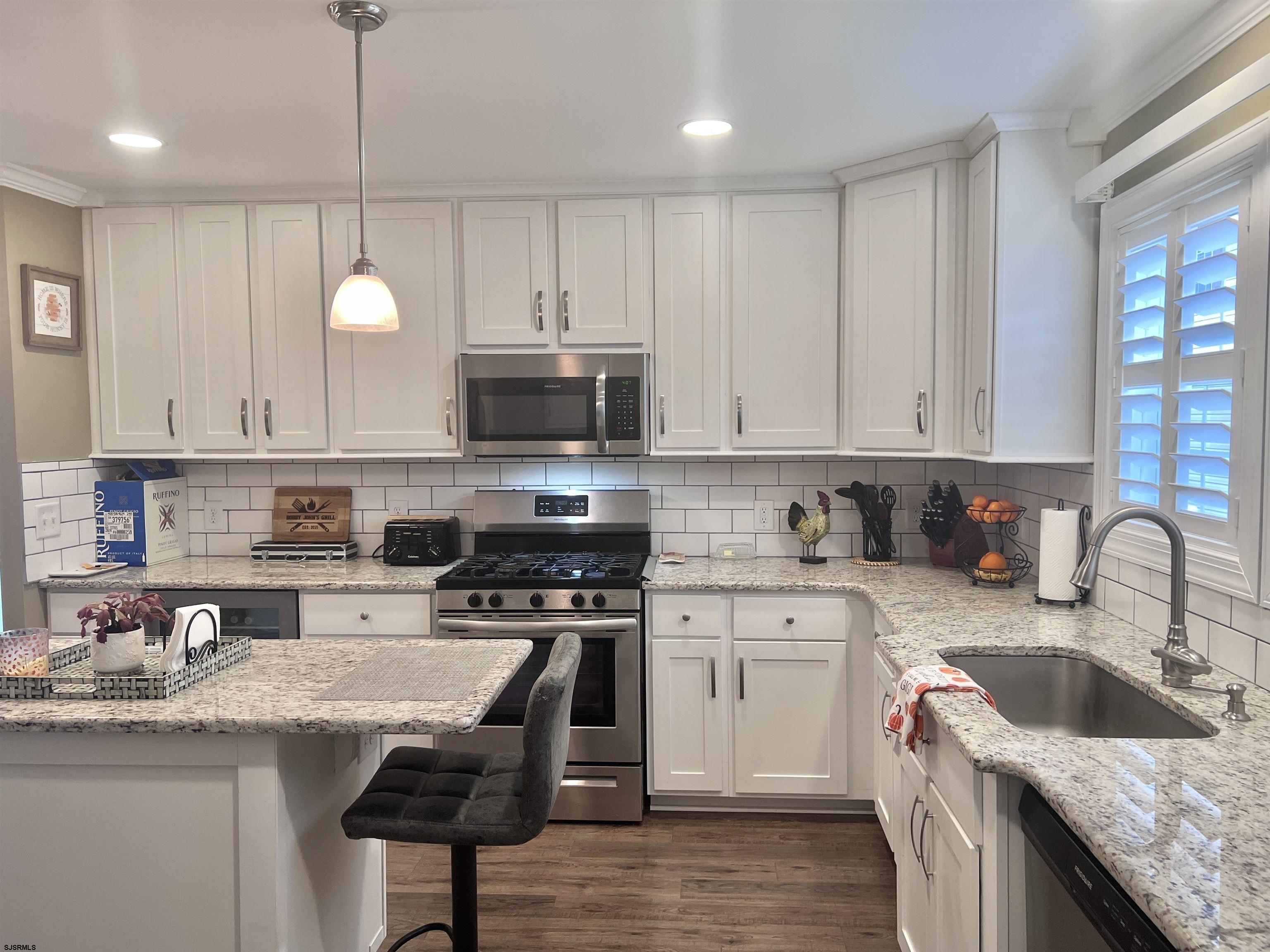2058 Highway 9 Ocean View, NJ 08230 - Photo 10 of 37 a kitchen with granite countertop a sink a counter top space appliances and cabinets