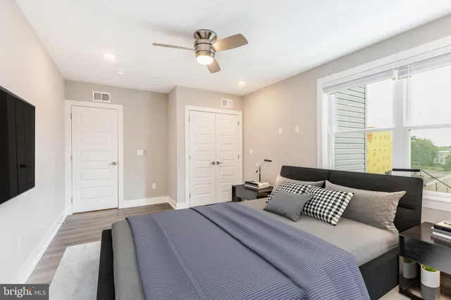 a bedroom with bed and window