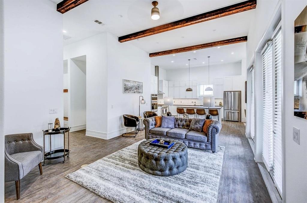 12001 Inwood Road, Unit 3701 Dallas, TX 75244 - Photo 2 of 15 Living room with beamed ceiling, ceiling fan, and light wood-type flooring