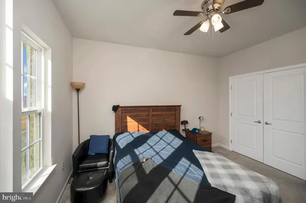 a bedroom with furniture and window
