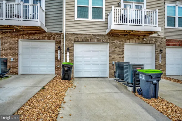 a front view of a house with a garage