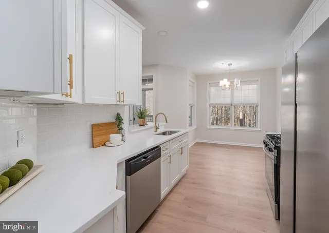 a view of a kitchen with electric appliances