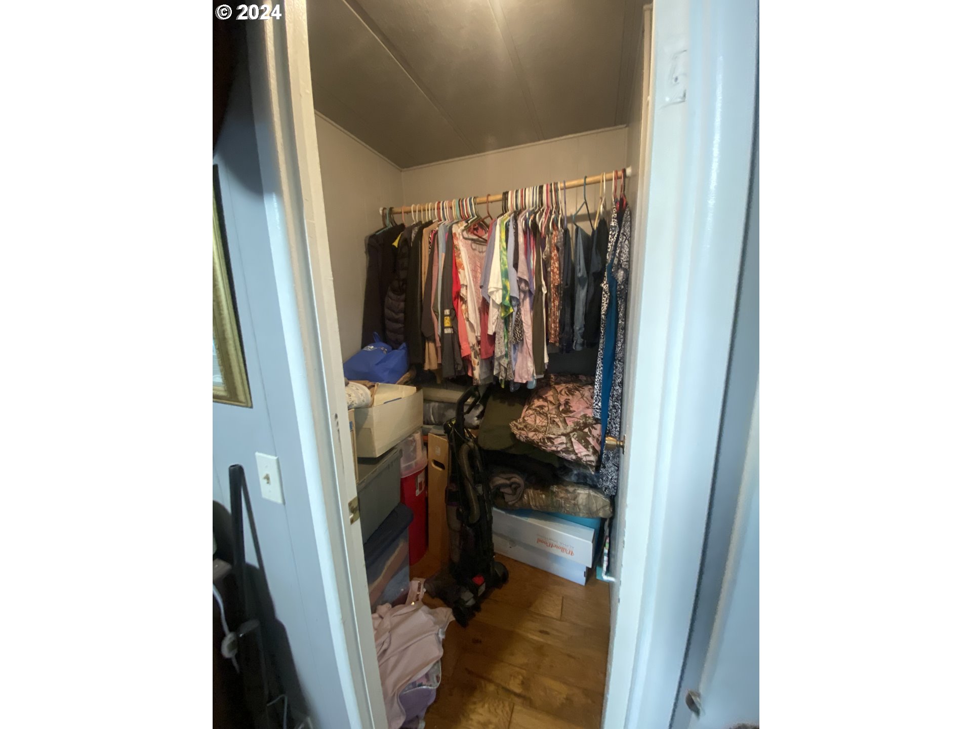 237 Waite Street Eugene, OR 97402 - Photo 15 of 17 a view of walk in closet with clothes and shoes
