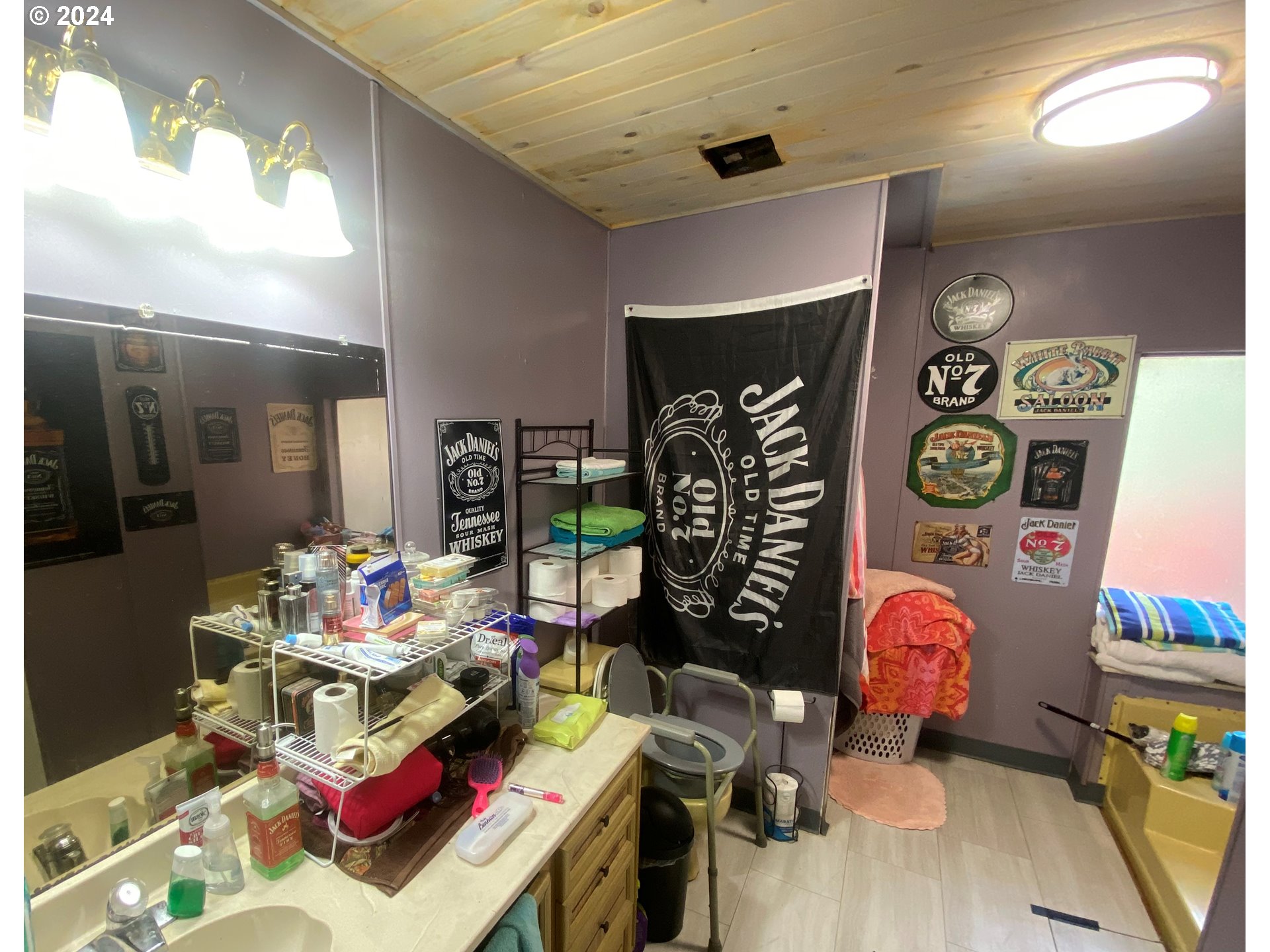 237 Waite Street Eugene, OR 97402 - Photo 16 of 17 a living room with lots of furniture and clutter
