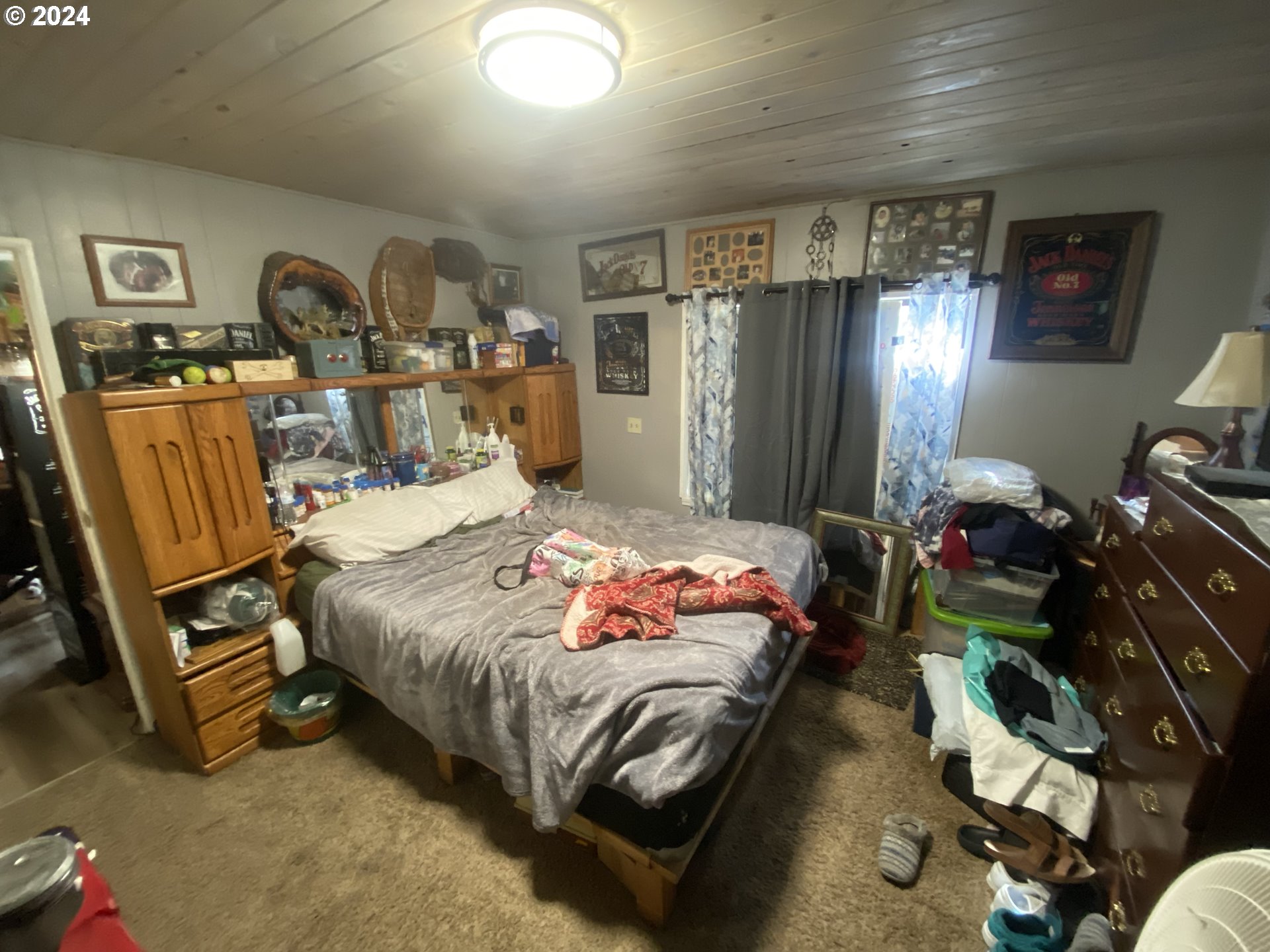 237 Waite Street Eugene, OR 97402 - Photo 17 of 17 a bedroom with a bed a dresser and many windows