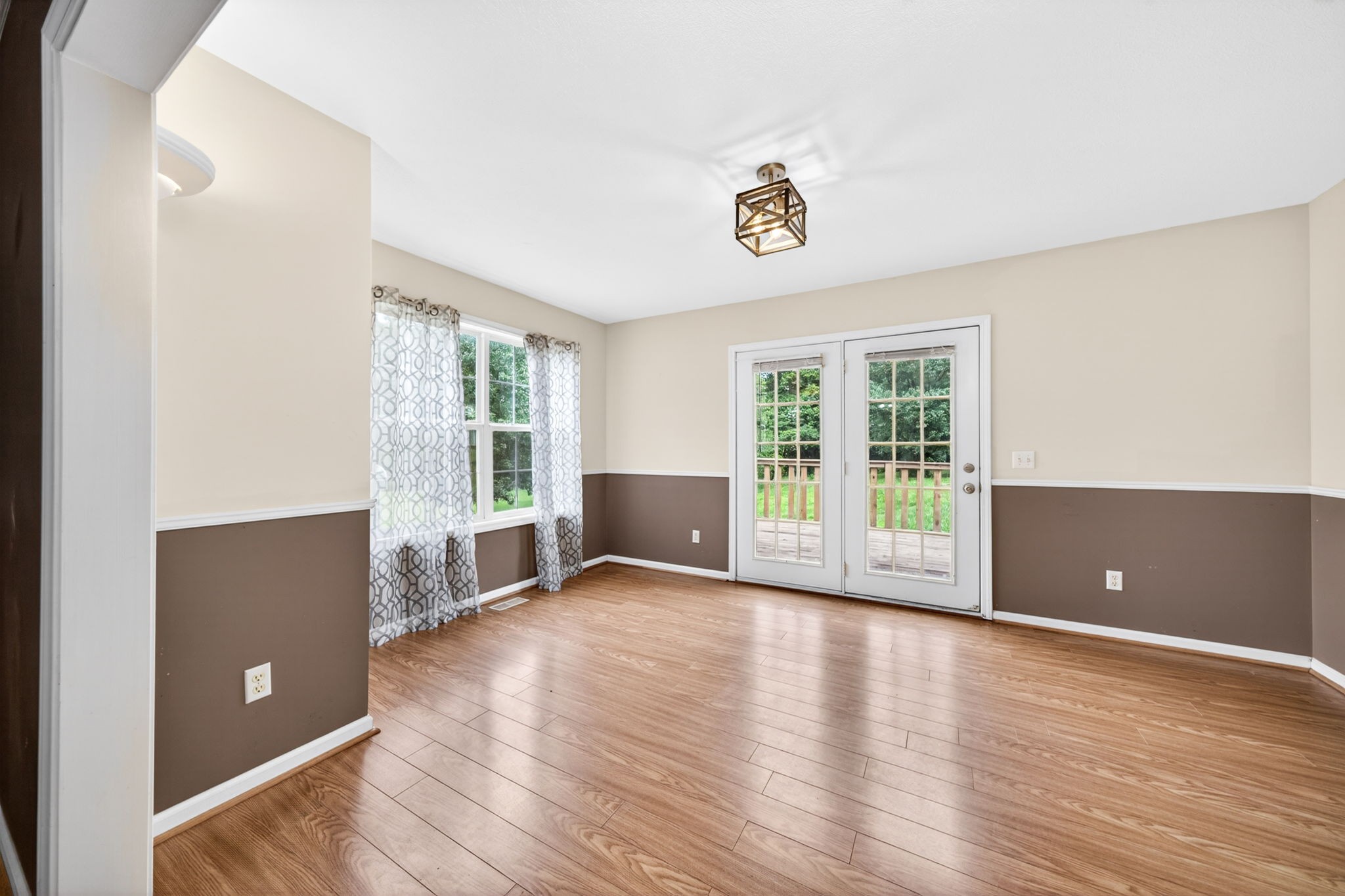 291 Poplar Point Lane Rickman, TN 38580 - Photo 3 of 41 an empty room with wooden floor and windows