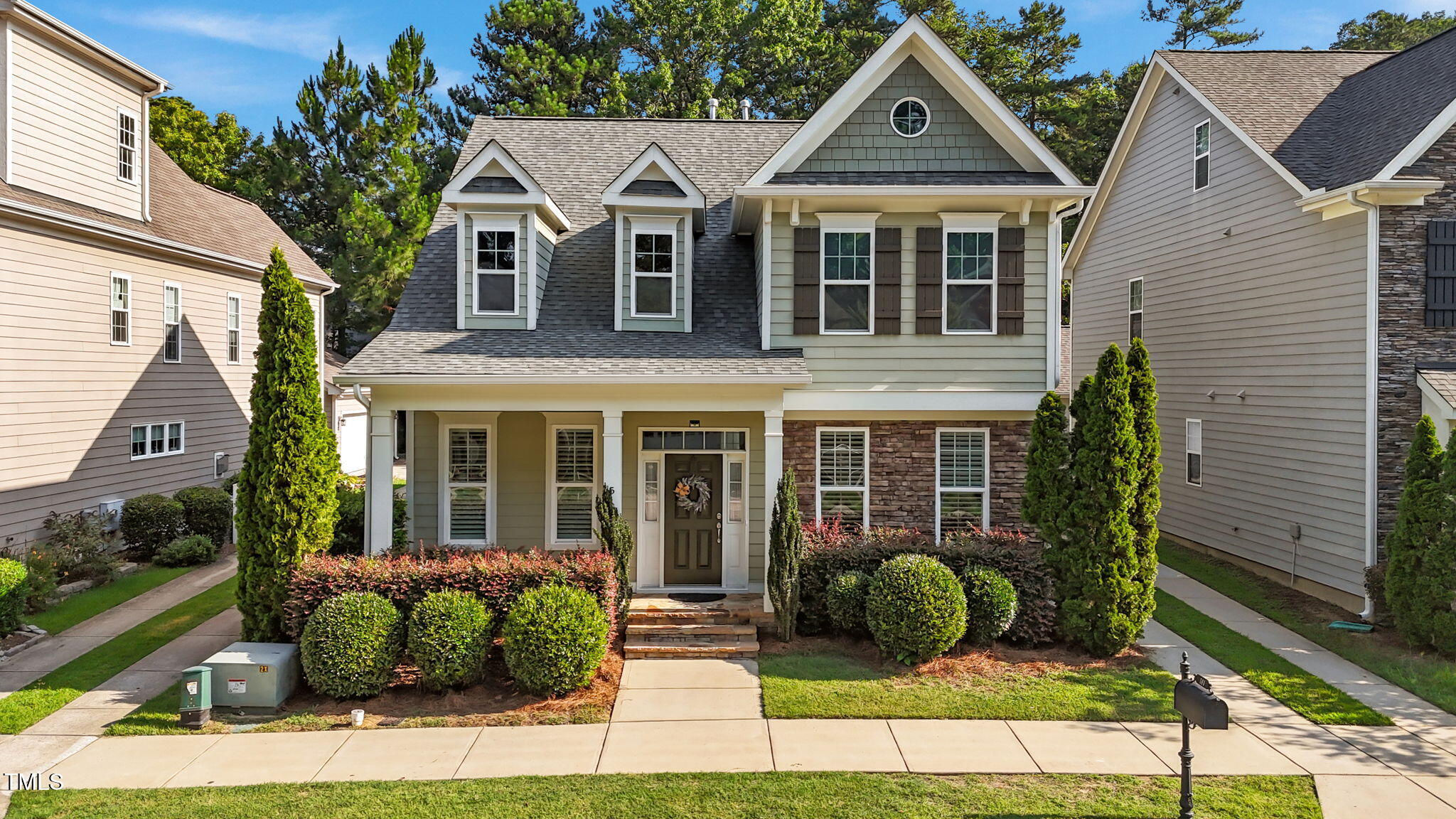 511 Mill Hopper Lane Apex, NC 27502 - Photo 1 of 53 a front view of a house with garden