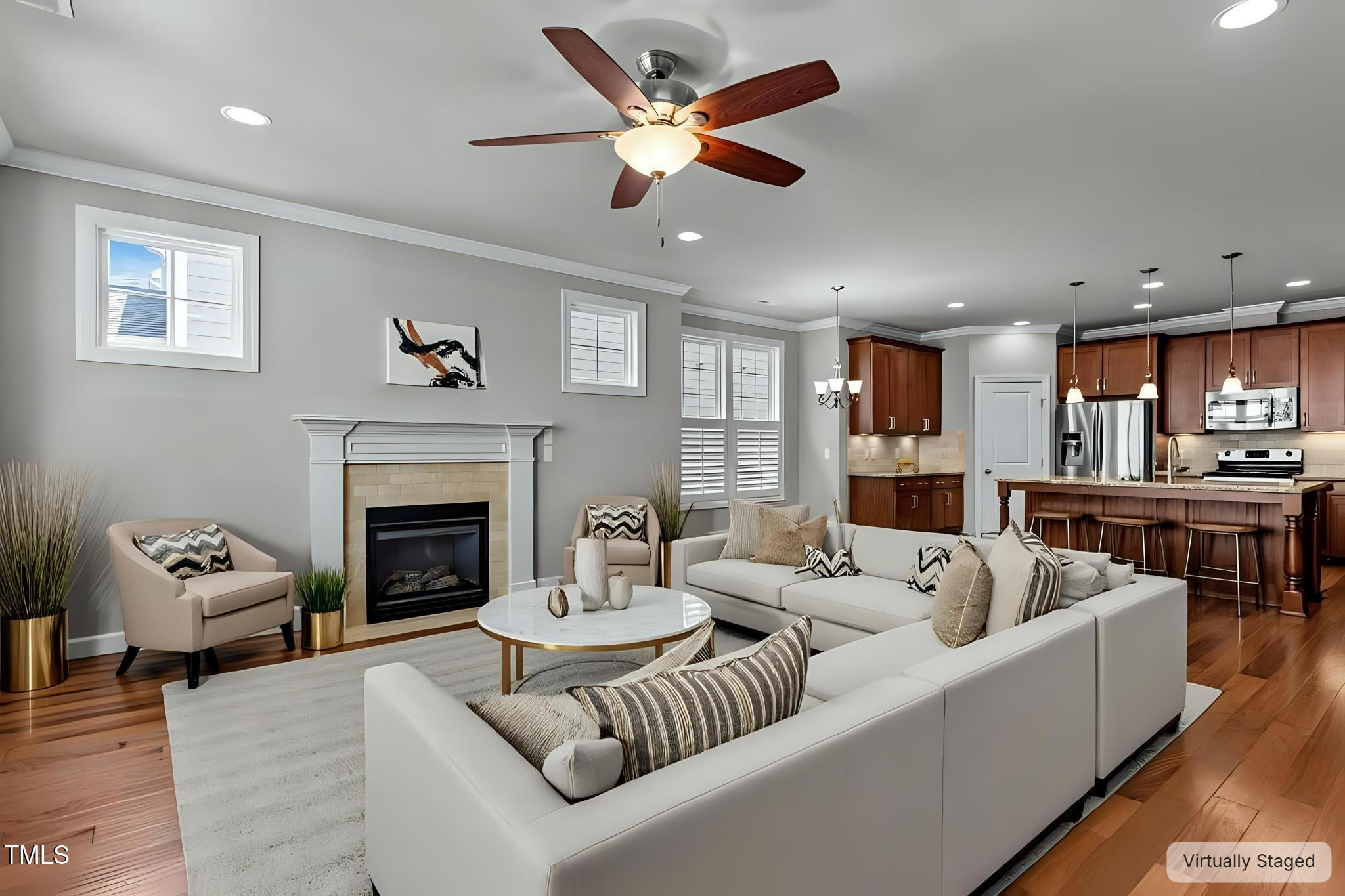 511 Mill Hopper Lane Apex, NC 27502 - Photo 15 of 53 a living room with furniture kitchen view and a fireplace