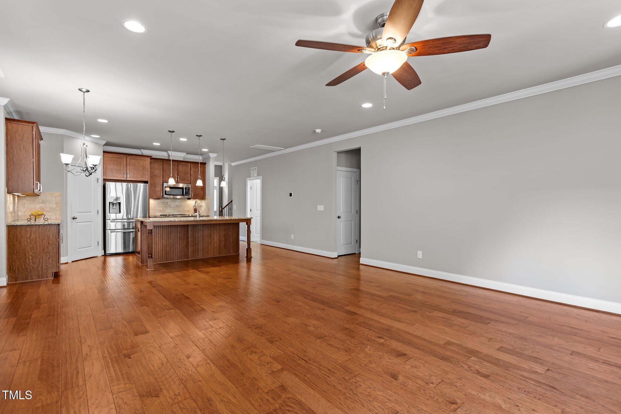 511 Mill Hopper Lane Apex, NC 27502 - Photo 17 of 53 a view of kitchen with wooden floor and a kitchen
