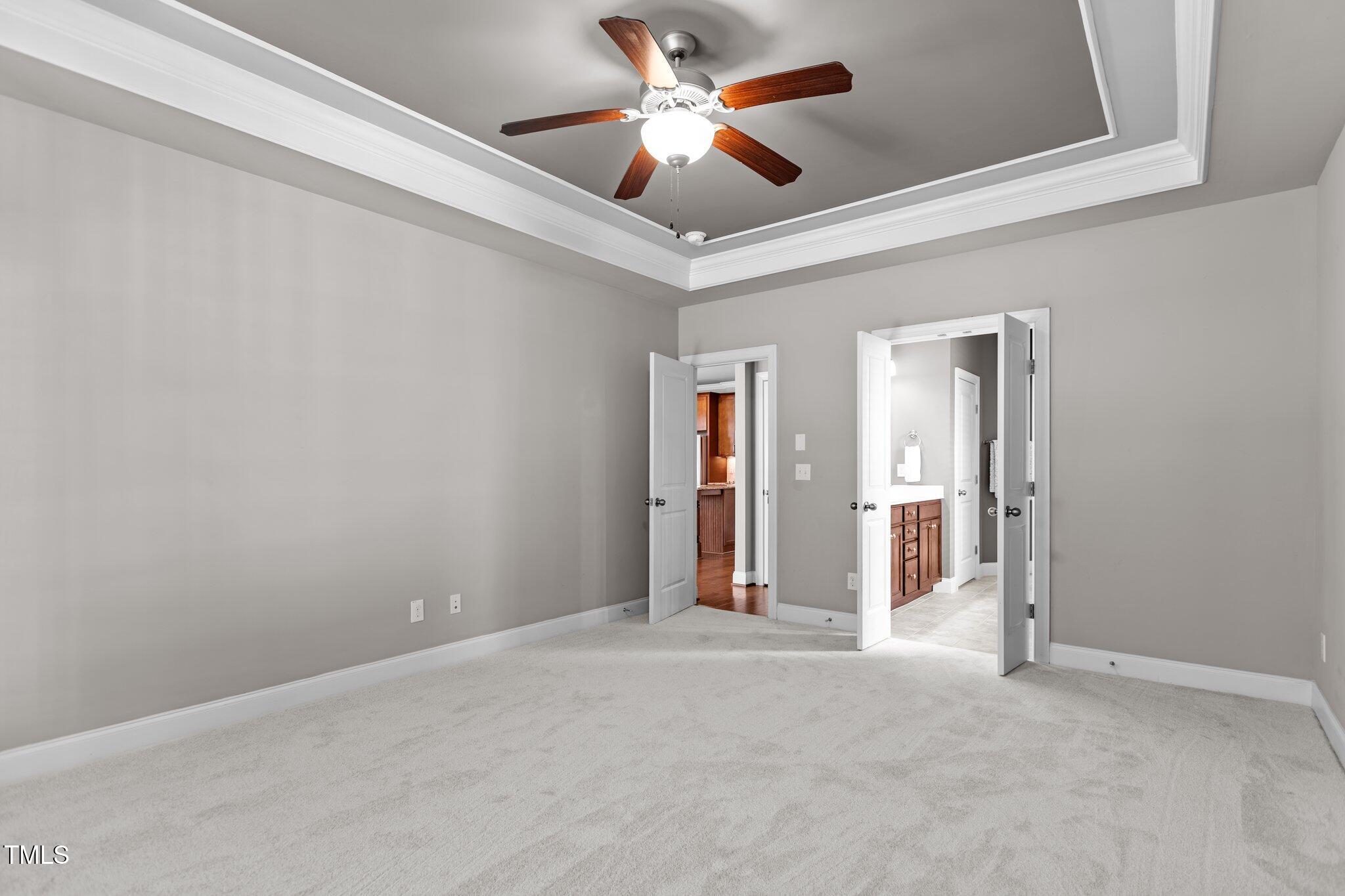 511 Mill Hopper Lane Apex, NC 27502 - Photo 20 of 53 an empty room with closet and a ceiling fan