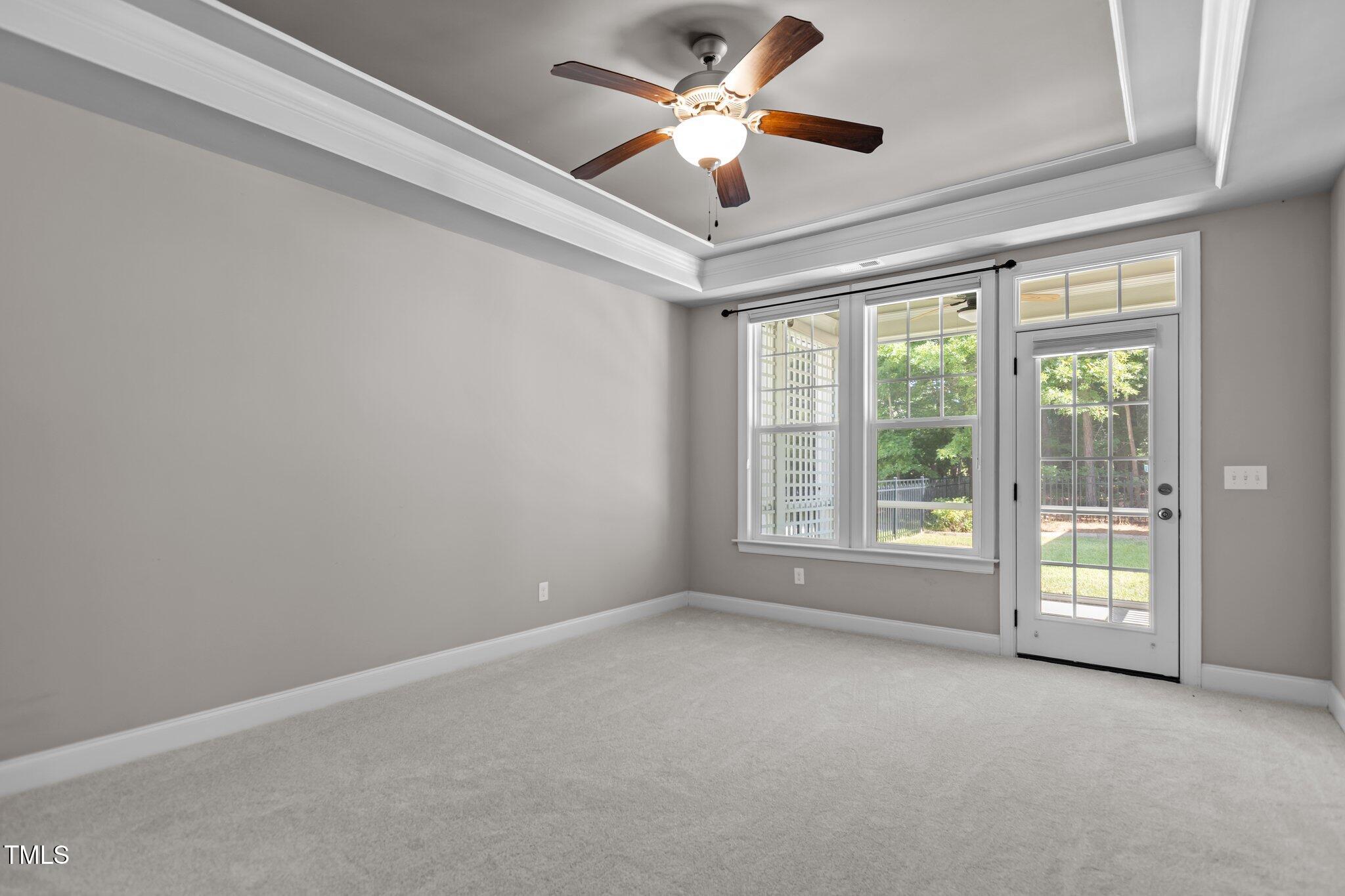511 Mill Hopper Lane Apex, NC 27502 - Photo 21 of 53 a view of room with a ceiling fan and window