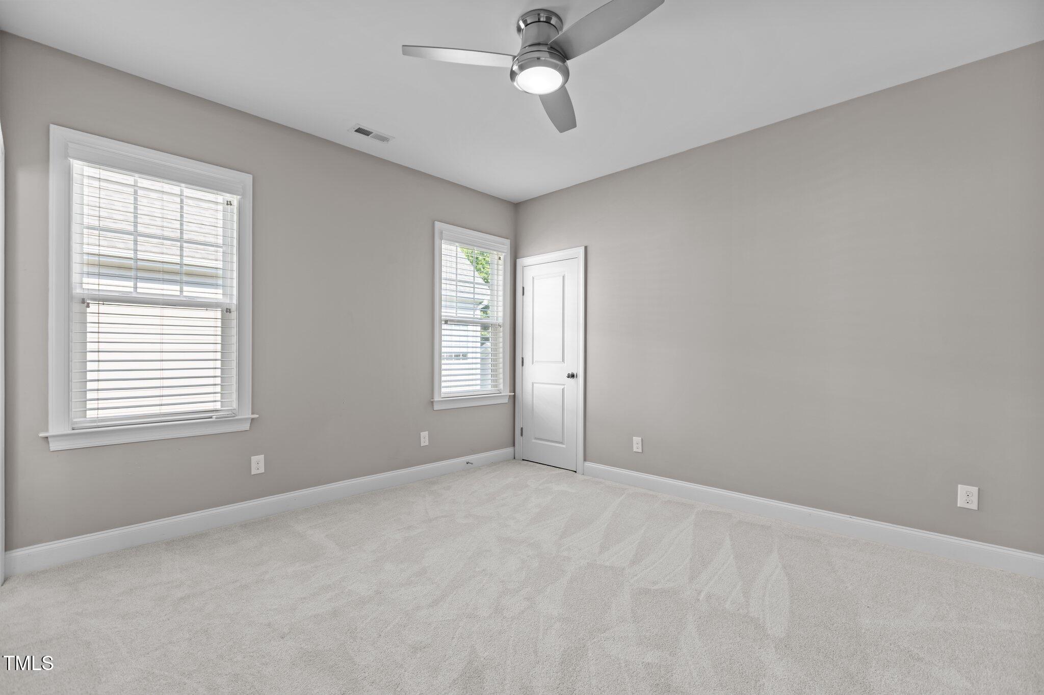 511 Mill Hopper Lane Apex, NC 27502 - Photo 30 of 53 a view of an empty room with a window