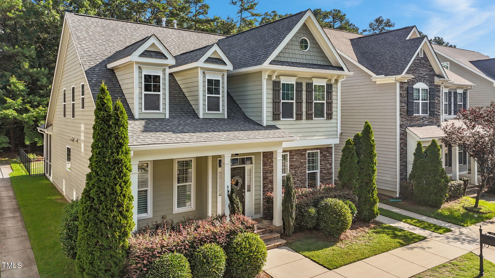 511 Mill Hopper Lane Apex, NC 27502 - Photo 3 of 53 a front view of a house with garden