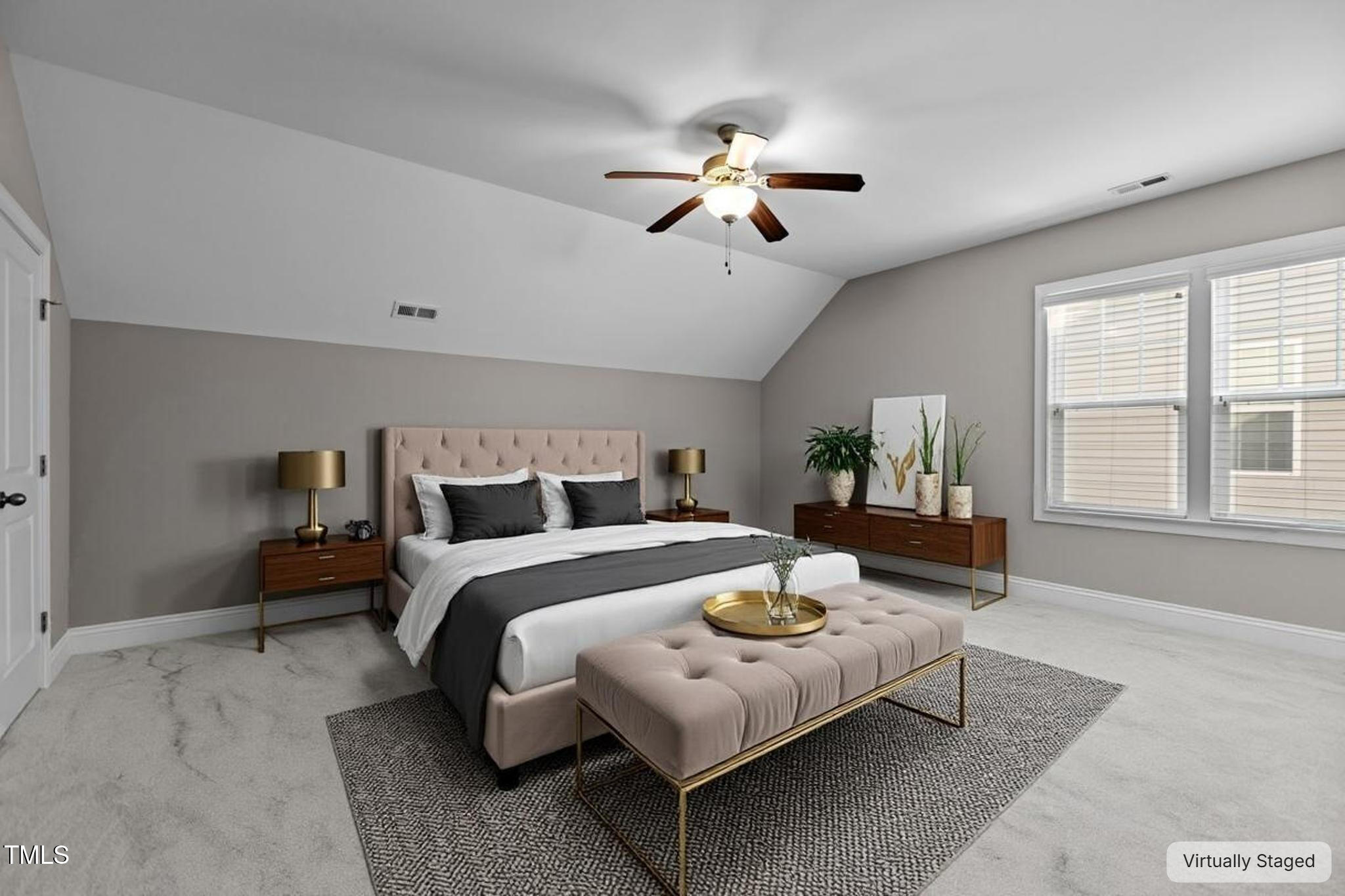 511 Mill Hopper Lane Apex, NC 27502 - Photo 32 of 53 a spacious bedroom with a bed a chandelier and windows