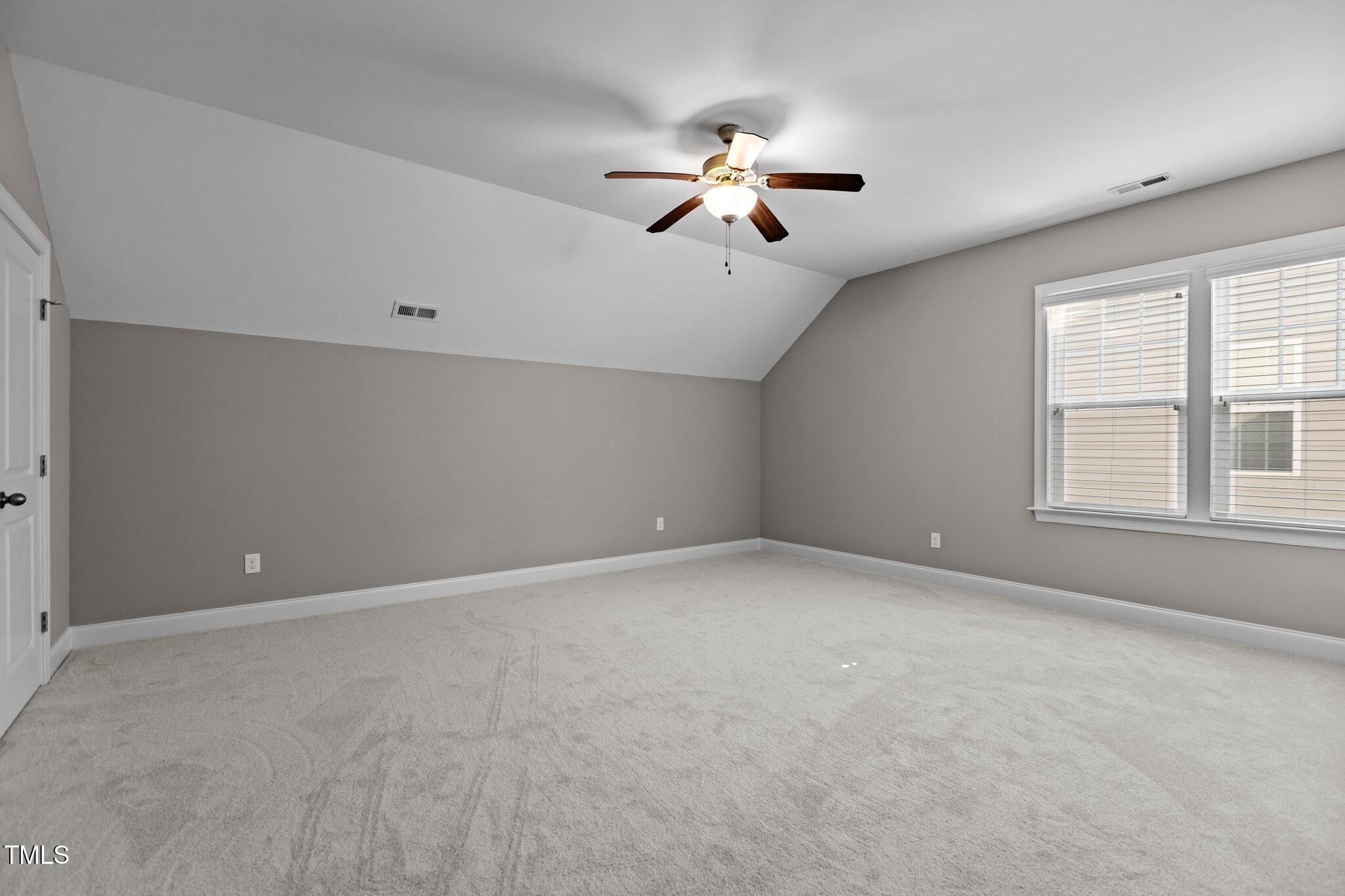 511 Mill Hopper Lane Apex, NC 27502 - Photo 33 of 53 a view of an empty room with a window