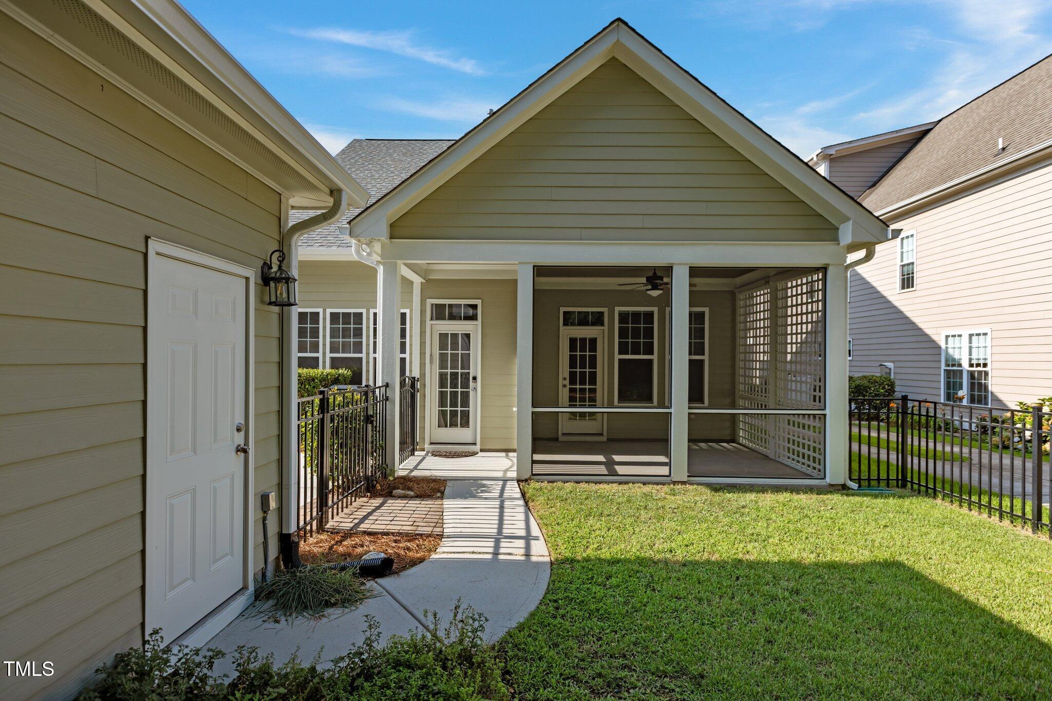 511 Mill Hopper Lane Apex, NC 27502 - Photo 42 of 53 a view of a house with backyard and a garden