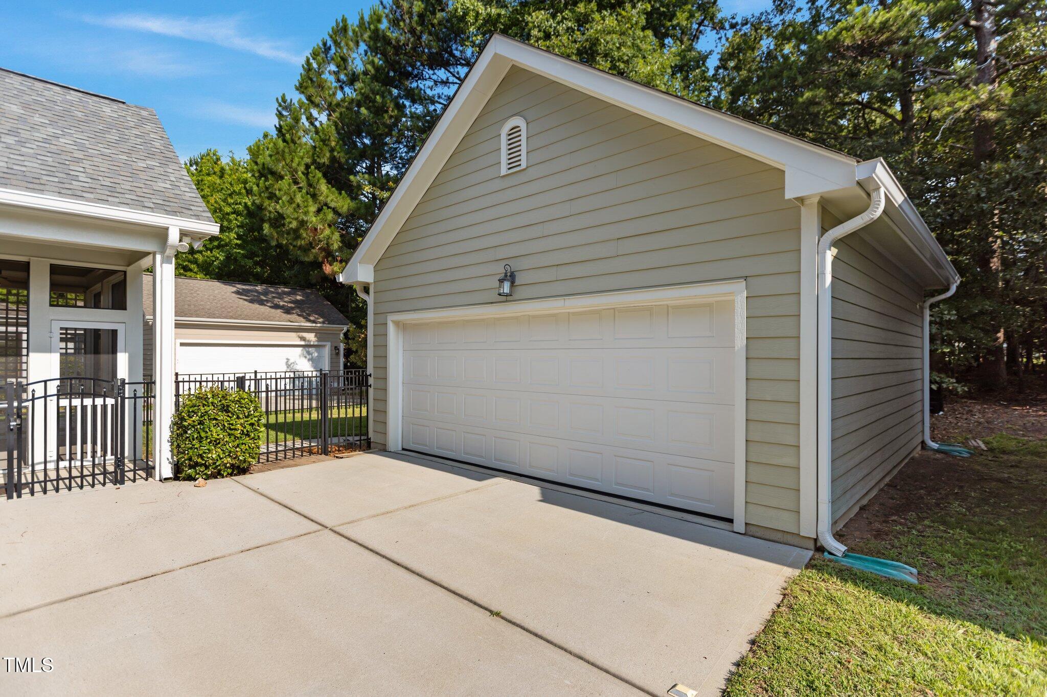511 Mill Hopper Lane Apex, NC 27502 - Photo 46 of 53 a view of a small house with a garage