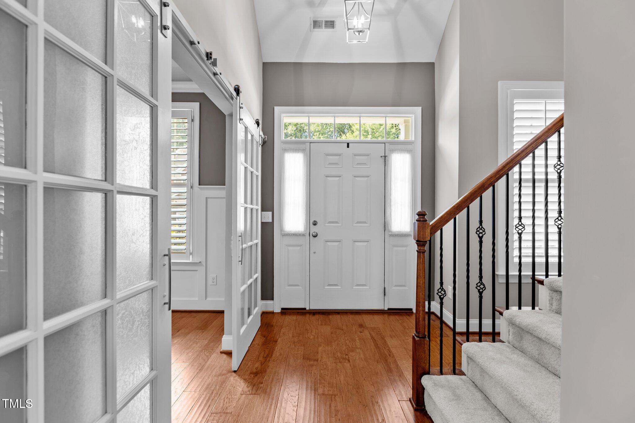 511 Mill Hopper Lane Apex, NC 27502 - Photo 5 of 53 a view of an entryway with wooden floor