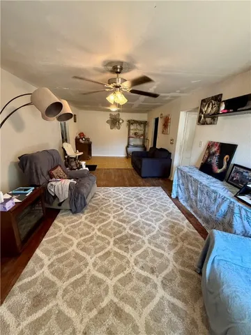 a bedroom with furniture and a chandelier