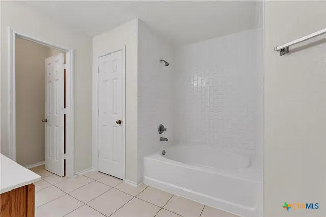 a kitchen with stainless steel appliances a refrigerator sink and microwave